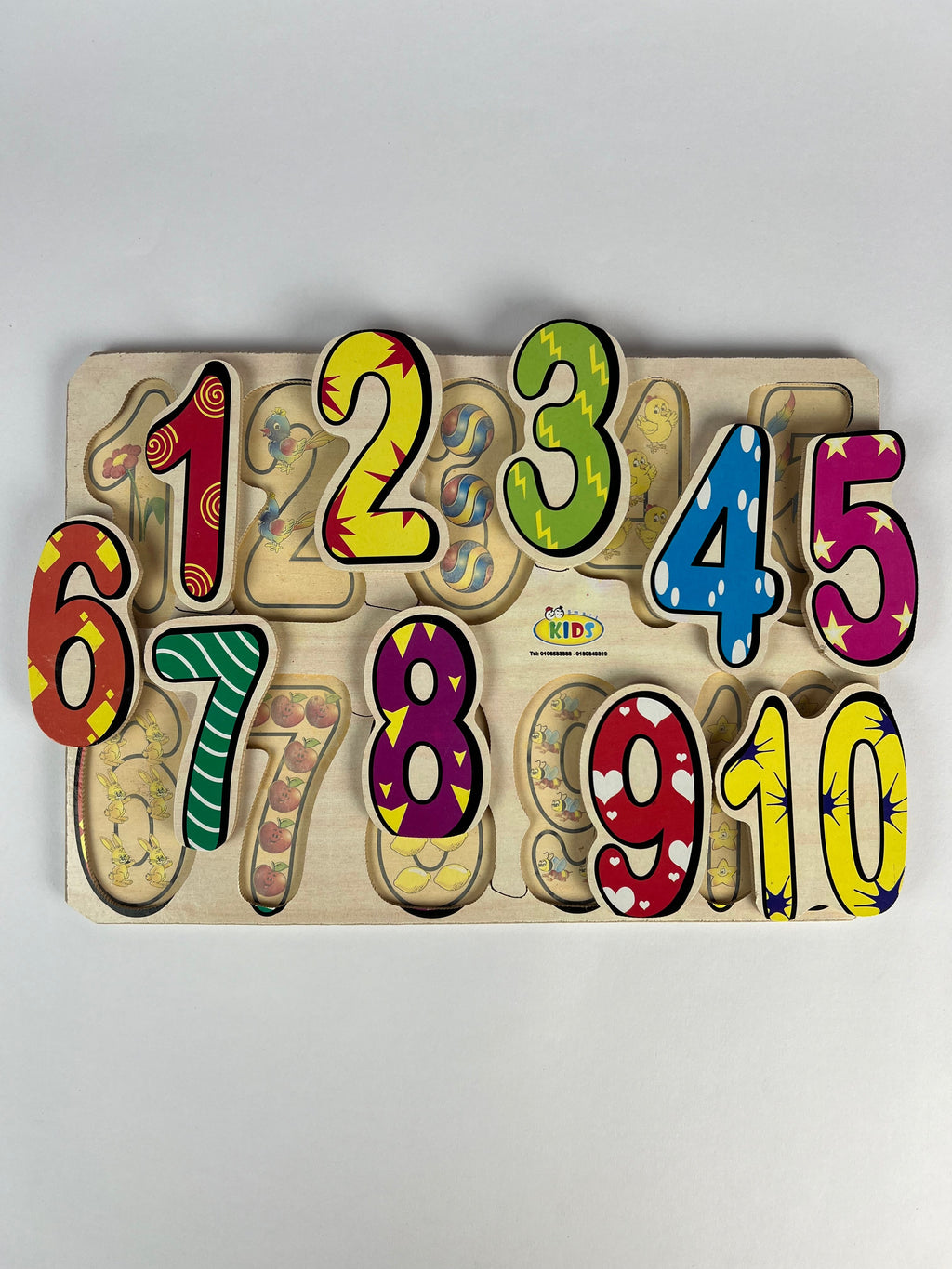 Colorful wooden number puzzle on a light gray background