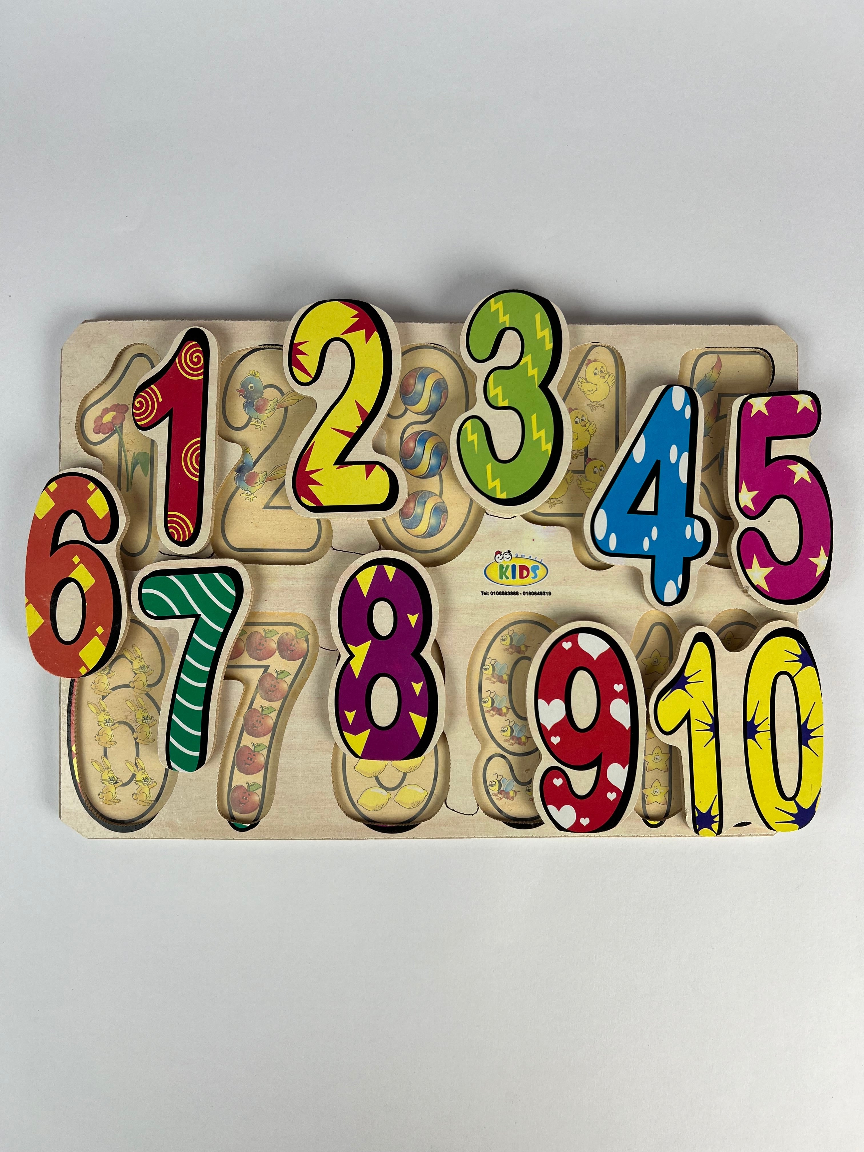Colorful wooden number puzzle on a light gray background