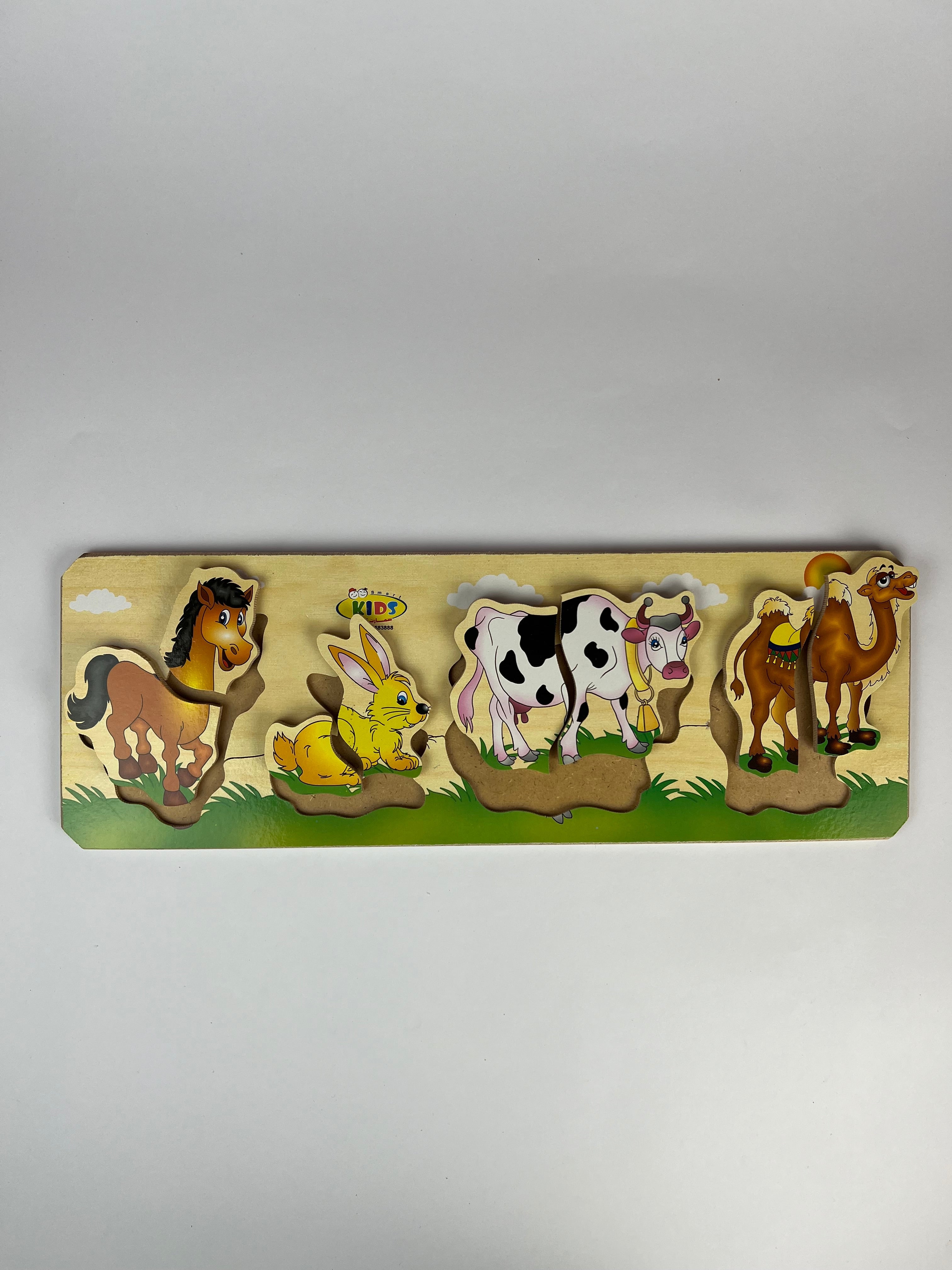Wooden puzzle with animal figures on a plain background
