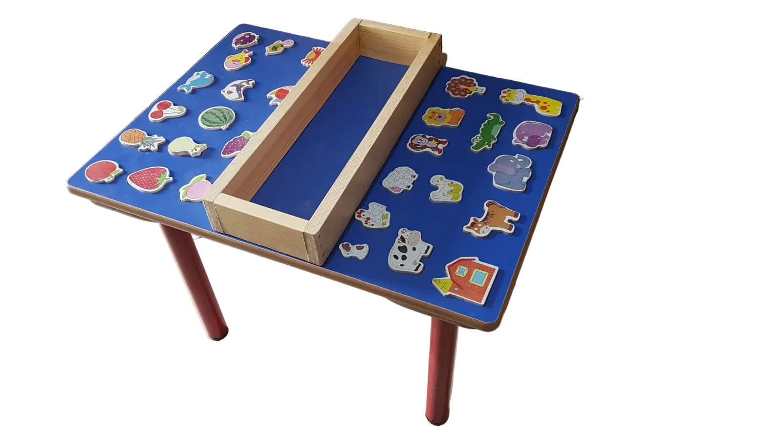 Children's educational table with puzzle pieces on a tiled floor